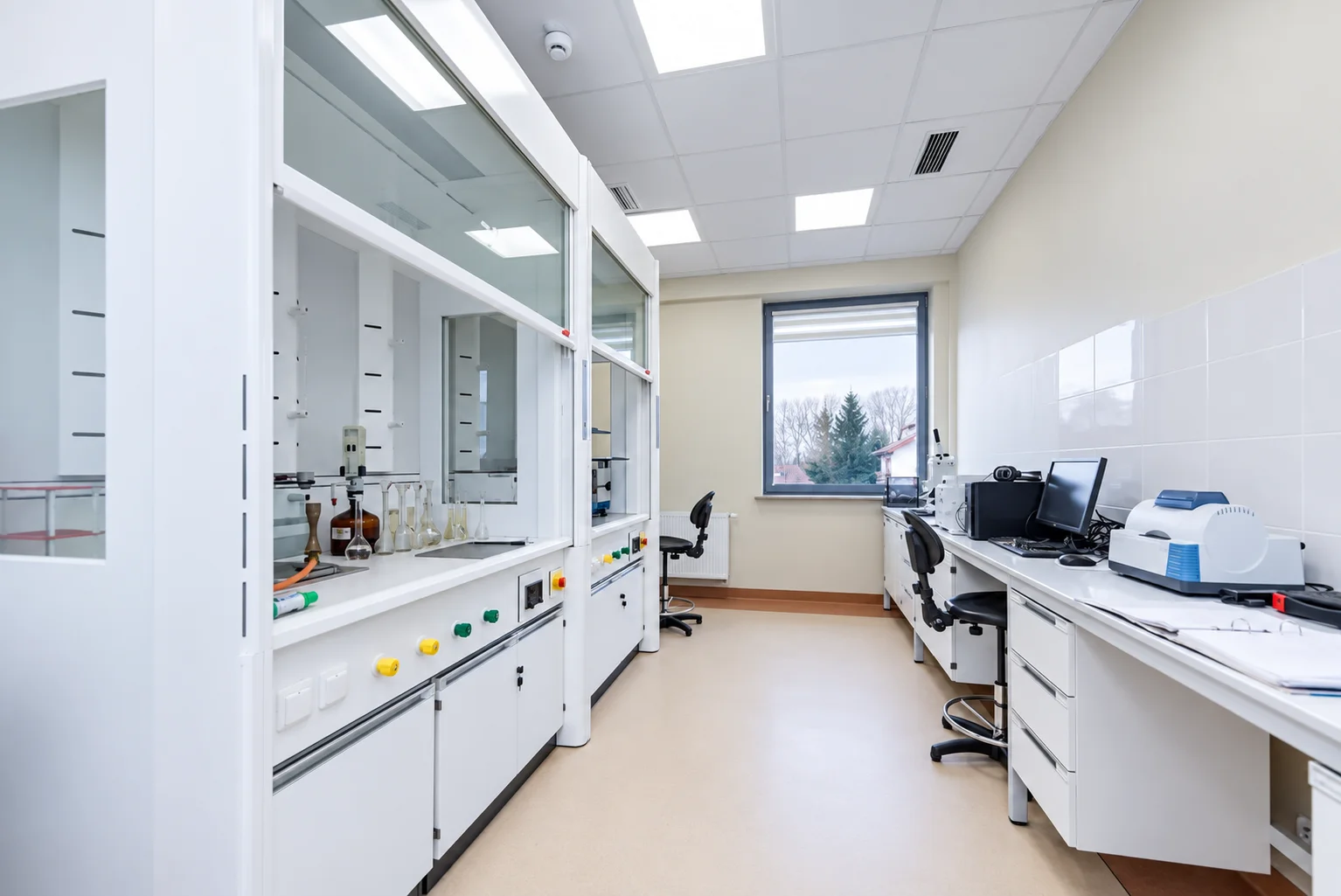Sanitary and Epidemiological Station in Radom: fume hoods along the wall and benches with instruments under the window